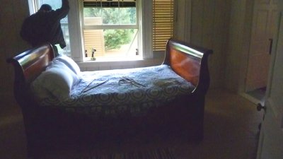 The middle bedroom out of 5 on the 2nd floor is the Guest Bedroom. That's a workman at the Palladian window!