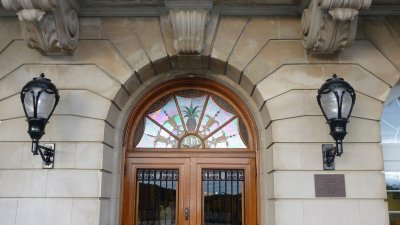 View of the lamps and stained glass design over the door.