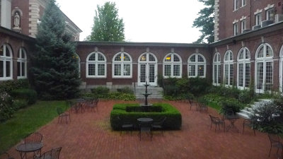 Interior courtyard at Roth Hall with a cobblestones and a fountain.