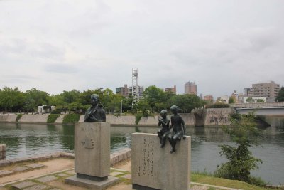 Memorial statues in front of the Ota River, the main river that flows through Hiroshima.