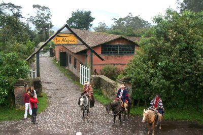 Ecuadorian cowboys greeting us at La Alegria hacienda, during a train stop on the Chiva Express.