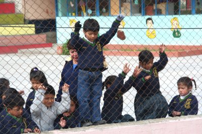 School children in Guamote lined up along this fence before the Chiva Express pulled away.