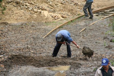 Fortunately, these workers freed the tracks for us.  We all passed a hat for them!