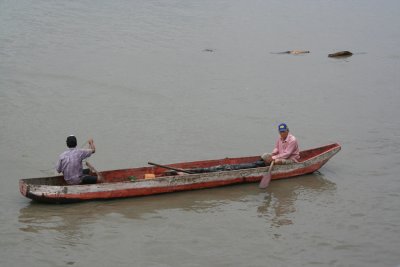 These fishermen were fishing in the Guayas River right off of the pier.
