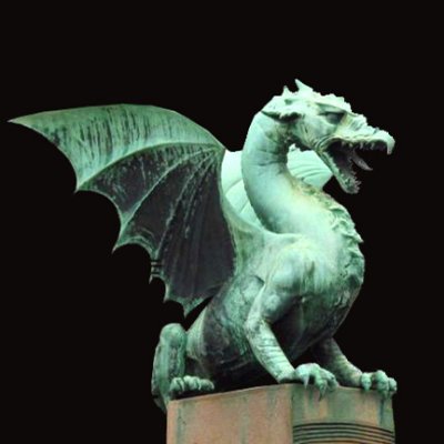 One of four green dragons on the Dragon Bridge, two on each side, stand proudly to guard the bridge and the city of Ljubljana.