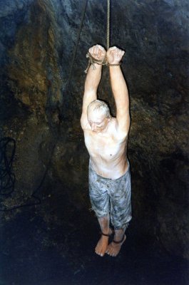 A mannequin hanging in the torture chamber in a demonstration of how people were punished in Predjamski Castle.