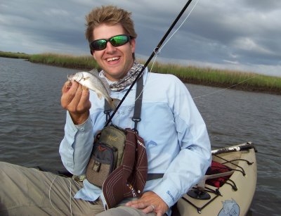 Chris with his 1st Baby Redfish