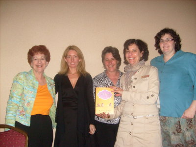 Kathryn Stockett (in black) surrounded by librarians