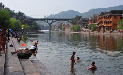 Fenghuang Miao children having water fun 2