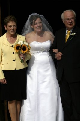 Bride and parents stepping out