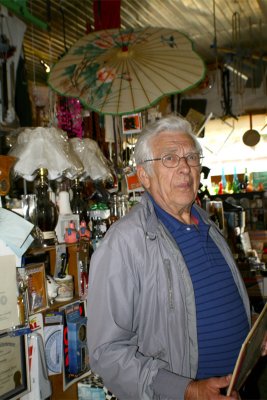 John proudly showing me around his store