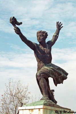 The Symbolic Figure of the Torch of Progress on the right of the Liberation Monument