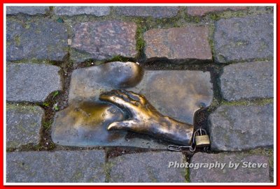 Amsterdam - Hand and Breasts (Sculpture embedded in a sidewalk)