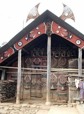 House in Kigwema. The horns on top of the roof show that its owner gave a feast of merit for the villagers.