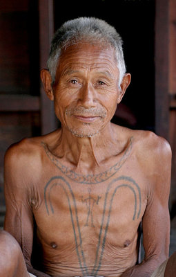 Another Khiamniungan Naga in Nokyan with tattoos of a successful headhunter.