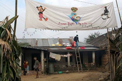 Mickey Mouse, Holy Mary and Hornbill together on a banner in Wanching.