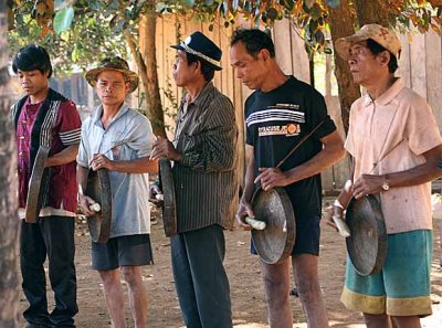 Kreung men playing the gongs. Beginning of harvest celebration in Kameng, Cambodia.