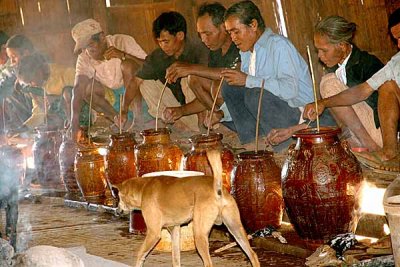 Before the rice wine is tasted, the Kreung people speak a short prayer. Kameng, Cambodia.