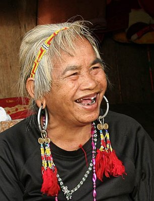 Lady with traditional Phnong jewellery. Pu Trom, Mondulkiri, Cambodia