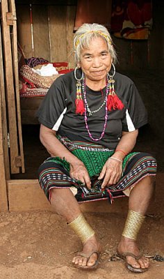 One of the last Phnong ladies with brass anklets on her legs. The Red Khmer forbade and destroyed these traditional rings.