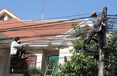 Repair of power cables in Seam Reap, Cambodia.