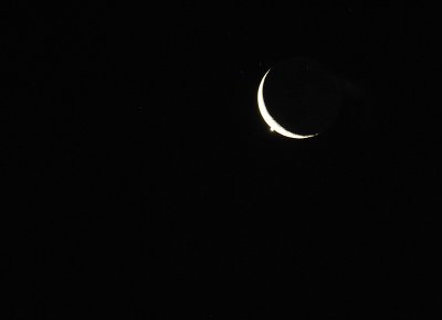 Venus disappearing behind the Crescent Moon