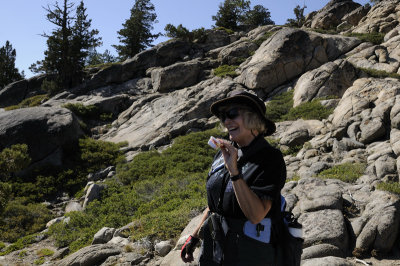 Sandy proudly showing her Geo Caching find