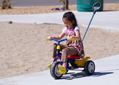 Lucy Riding Tricycle