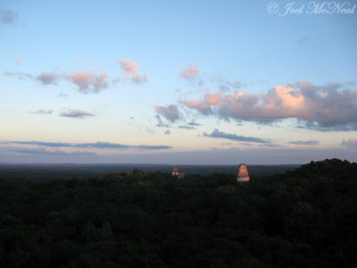 View of Temples III, II, and I from atop Temple IV at sunset