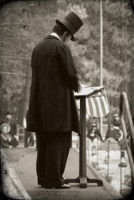 Max Daniels as Abraham Lincoln.