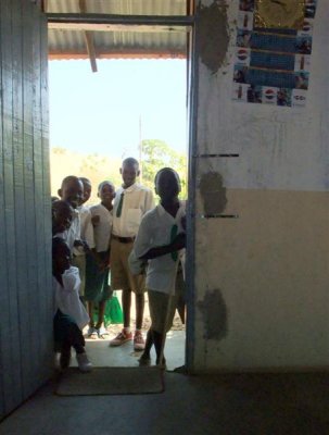 Local school children looking at Mzungus in the headmistresses office