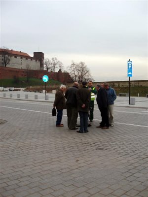 Polish men inspecting manhole