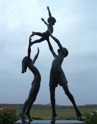 Tresco - bronze children playing on a grey day