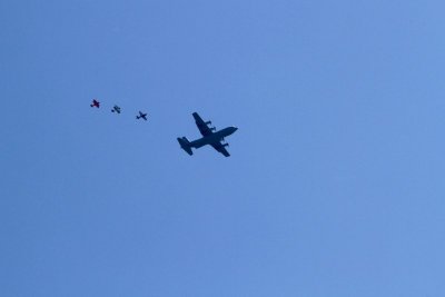 C130 with parachute team and escort  planes