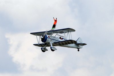 Dave Dacy  piloting the Super Sterman and Tony Kazian walking the wing