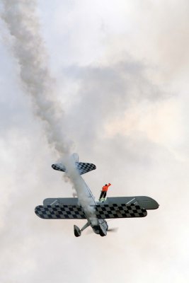 Dave Dacy piloting the Super Sterman and Tony Kazian walking the wing