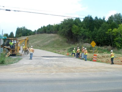 Road Crew. One Works; Ten Watch.