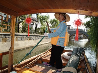 Boat woman plying her trade in Zhouzhuang