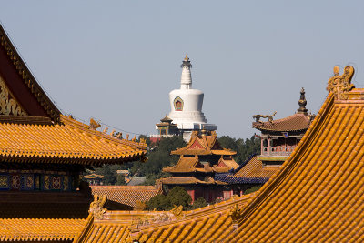 The White Pagoda of Beihai park peeking above the roofs of the Forbidden City.