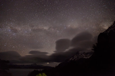 The Milky Way, the southern cross, the Paine Grande Massif, and Venus setting below the clouds.
