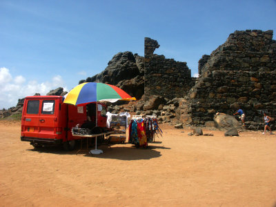 A vendor selling dresses in the middle of nowhere