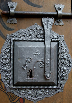 Ornate lock on castle entrance door
