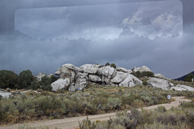 CITY OF ROCKS: A BUS WINDOW REFLECTION