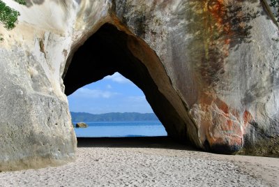 Cathedral Cove archway fills with water at high tide.