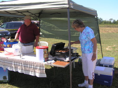 Bill and Marva cooking Hotdogs