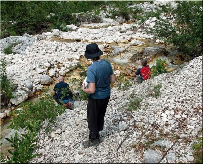 Filling up our water bottles in a stream in the Trenta Valley.jpg