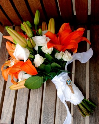 Vendela roses, white mini-roses and orange tropical lilies. Photo by Kate Brahnsen