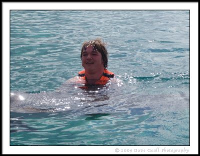 Matthew Hugs A Dolphin