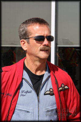 Chris Hadfield watches the Snowbirds arrive