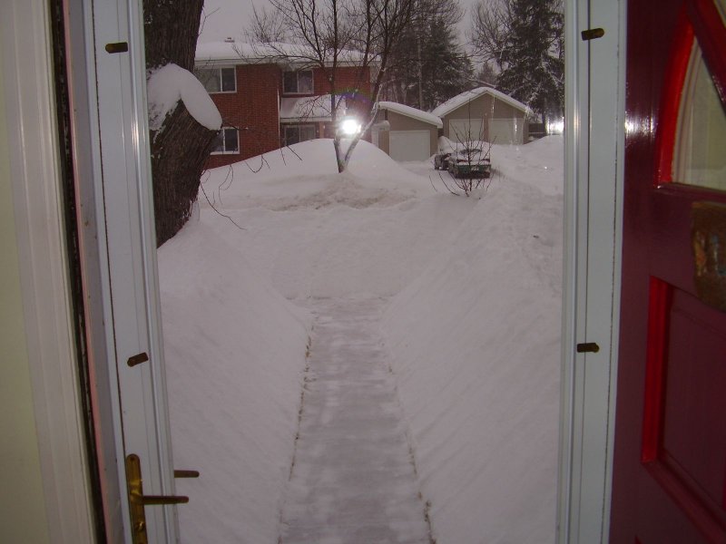 Out the front door... note the pile across the street from the snowblower